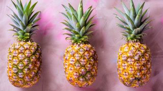 Pineapple AI Wallpaper: Colorful Pink Background for Desktop