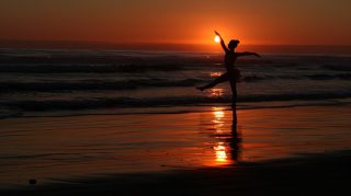 Free Download: Gymnast Beach Sunset Wallpaper for Desktop