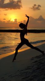 Enhance Your iPhone with Beach Sunset Gymnastics Wallpaper