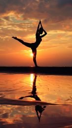 Stunning Gymnastics Photo with Beach Sunset Background