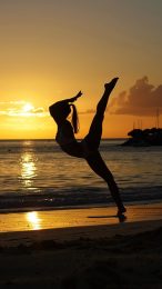 Silhouette Gymnast at Sunset: Free Mobile Wallpaper